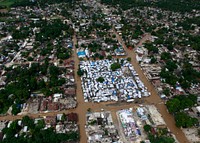 Floodwaters surround a tent city outside Port-au-Prince, Haiti, during a flyover by a U.S. Marine Corps helicopter Nov. 6, 2010.