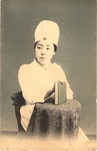 Japanese Nurse Holding a Book. Color photo of a Japanese nurse in her nursing uniform holding a book on a table and sitting on a chair. Original public domain image from Flickr