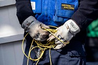 BRITISH ISLES (May 27, 2021) Personnel Specialist 2nd Class Keeth Prince, from Gulfport, Miss., holds a grounding cable during a refueling evolution flight aboard the Arleigh Burke-class guided-missile destroyer USS Paul Ignatius (DDG 117) during exercise At-Sea Demo/Formidable Shield, May 27, 2021.
