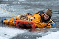 JBER firefighters conduct ice rescue trainingU.S. Air Force Staff Sgt. Joseph Jenkins, right, a fire protection specialist assigned to the 673d Civil Engineer Squadron, extricates a simulated cold-water casualty during ice rescue training at Six Mile Lake on Joint Base Elmendorf-Richardson, Alaska, Jan. 8, 2023. After completing a classroom course, the JBER firefighters took to the ice to test their skills in a series of scenarios designed to simulate real-world rescues. The firefighters received certifications as ice rescue technicians having qualified in the skills needed to conduct rescue and recovery operations in extreme cold-weather environments. (U.S. Air Force photo by Alejandro Peña)