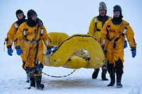 U.S. Air Force fire protection specialists assigned to the 673d Civil Engineer Squadron conduct ice-rescue training at Sixmile Lake on Joint Base Elmendorf-Richardson, Alaska, Jan. 8, 2023. 