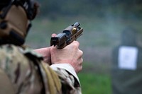 Soldier fires the M18 Modular Handgun System during small arms live-fire training.