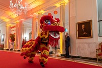 The Choy Wun Lion Dance Troupe makes their way through the Cross Hall to a Lunar New Year celebration in the East Room, Thursday, January 26, 2023, at the White House. (Official White House Photo by Carlos Fyfe)