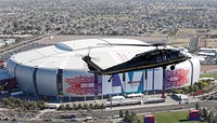 A U.S. Customs and Border Protection Air and Marine Operations UH-60 Black Hawk helicopter conducts a flyover of State Farm Stadium as CBP provides significant security in advance of Super Bowl LVII in Glendale, Ariz., Feb. 6, 2023. CBP Photo by Glenn Fawcett 