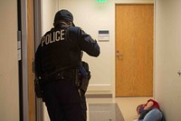 Security forces personnel respond to a simulated threat during an active shooter training exercise held at Naval Health Clinic Annapolis. 
