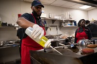 Trainer advocates and interns at Café Reconcile prepare food during a lunch service in New Orleans, La., Feb. 16, 2023. Café Reconcile runs a volunteer program serving self-initiated youth ages 16-24 who reside in the Greater New Orleans area. Café Reconcile combines hands-on food service training with classroom instruction, individual case management, job placement services, and follow-up support to develop a participant’s ability to become independent, self-sufficient, and successfully employed. Featuring soul-filled local dishes, Café Reconcile is a destination lunch spot for a wide cross-section of New Orleanians as well as visitors from all across the country. Focusing on the kind of “soul food” for which New Orleans is known, the restaurant has earned high praise from local and national critics. The Supplemental Nutrition Assistance Program Employment and Training initiative offers SNAP recipients in Louisiana the opportunity to gain skills, training and work experience. The program is funded by the U.S. Department of Agriculture Food and Nutrition Service, and its goal is to help participants secure regular employment and achieve economic self-sufficiency. (USDA photo by Christophe Paul)  