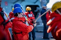 BALTIC SEA (March 9, 2023) Boatswain&rsquo;s Mate Seaman Phoebe Day, assigned to the Arleigh Burke-class guided-missile destroyer USS Porter (DDG 78), handles line during small boat operations with the Swedish Navy first-in-its-class HSwMS Stockholm (P11), March 9, 2023. Porter is on a scheduled deployment in the U.S. Naval Forces Europe area of operations, employed by the U.S. Sixth Fleet to defend U.S., allied and partner interests. (U.S. Navy photo by Mass Communication Specialist 2nd Class Sawyer Connally)