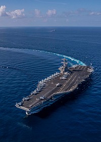 The Nimitz-class aircraft carrier USS George H.W. Bush (CVN 77)and the Carlo Bergamini-class frigate ITS Virginio Fasan (F 591) transit the Mediterranean Sea.