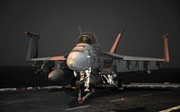 A U.S. Navy F/A-18 Super Hornet aircraft is chained to the flight deck aboard aircraft carrier USS Abraham Lincoln (CVN 72) Dec. 19, 2010, in the Arabian Sea. The Lincoln Carrier Strike Group was deployed to the U.S. 5th Fleet area of responsibility in support of maritime security operations.