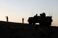 Marines of the Personal Security Detail, 1st Marine Logistics Group (Forward) (MLG FWD), guide their Mine Resistant, Ambush-Protected vehicle down a steep incline during a mounted patrol through Garmser district, Helmand province, Afghanistan, January 6, 2011.