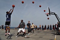 In this 7-image composite photo, U.S. Navy Machinists Mate Fireman Geoffrey Byrd launches a successful shot during a basketball tournament in celebration of the deployment half-way point on the flight deck of USS Ponce (LPD 15) while under way in the Persian Gulf, Jan. 5, 2011.