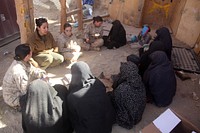 Afghan women attend a shura, or meeting, hosted by U.S. Marine Corps female engagement team members assigned 3rd Battalion, 5th Marine Regiment, Regimental Combat Team (RCT) 2 at Forward Operating Base Jackson in Sangin district, Afghanistan, Jan. 18, 2011.