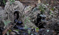 U.S. Air Force Senior Airman Antwone Dunlap, left, a sniper team spotter, and Airman 1st Class Ricky Smith, a sniper team shooter, both assigned to the 822nd Base Defense Squadron, prepare to provide cover fire for Airman during an urban operations training demonstration at Moody Air Force Base, Ga., Feb. 10, 2011.