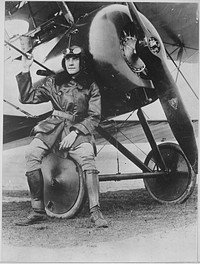 Lieutenant Earl Carroll, prominent composer, is now a full-fledged aviator in the U.S. Service. He is shown beside his fast scout machine. International Film Service., ca. 1918. Original public domain image from Flickr