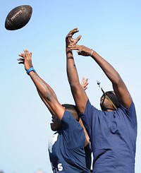 ARABIAN GULF (Nov. 2, 2011) Sailors jump to catch a football during a steel beach aboard the flight deck of the aircraft carrier USS George H.W. Bush (CVN 77).