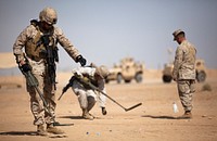 U.S. Marine Corps Lance Cpl. Barney Oldfield, a rifleman with Headquarters and Service Company, 3rd Battalion, 3rd Marine Regiment, uses a bottle cap to mark the location of a mock improvised explosive device during metal detector training Nov. 3. After departing from Hawaii from Oct. 27 through at Camp Dwyer, Afghanistan, Nov. 1, 2011.