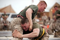 U.S. Marine Lance Cpl. Keith Silva, right, attempts to take down Lance Cpl. Brett P. Schwindt, during a ground fighting tournament at Camp Dwyer, Afghanistan, March 10, 2012.