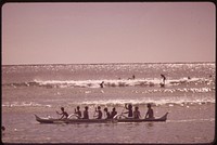 Outrigger canoes and surfers at Waikiki Beach, October 1973. Photographer: O'Rear, Charles. Original public domain image from Flickr