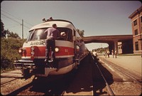 Turboliner engine's windshield is cleaned as the passenger train is stopped at Bloomington, Illinois, enroute from St. Louis Missouri, to Chicago, June 1974. Photographer: O'Rear, Charles. Original public domain image from Flickr