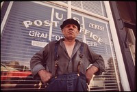 Charlie Gross outside Grafton post office. A former farmer truck driver, boxer, dog raiser and salesman, he has lived in Nebraska more than half his life, May 1973. Photographer: O'Rear, Charles. Original public domain image from Flickr