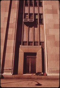 Homeless Man Sleeping On Doorway Of Penn Central's 30th Street Station, August 1973. Photographer: Swanson, Dick. Original public domain image from Flickr