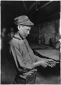 Carrying-in-boy- at the Lehr (15 years old). Has worked for several years. Works nine hours. Day shift one week, night shift next week. Gets $1.25 per day, October 1908. Photographer: Hine, Lewis. Original public domain image from Flickr