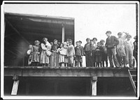 Oyster shuckers and baby tenders at Pass Packing Co. All worked from before daybreak until 5 P.M., February 1911. Photographer: Hine, Lewis. Original public domain image from Flickr