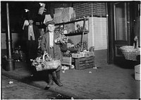 At center market. 11 year old celery vender. Has been in this country only half a year, April 1912. Photographer: Hine, Lewis. Original public domain image from Flickr