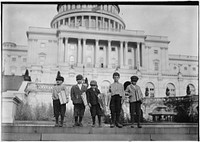 Group of newsies selling on capitol steps, April 1912. Photographer: Hine, Lewis. Original public domain image from Flickr