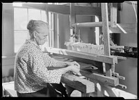 Aunt Lizzie Reagan, at the Pi Beta Phi School, Gatlinburg, Tennessee, weaving old-fashioned jean, November 1933. Photographer: Hine, Lewis. Original public domain image from Flickr
