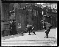 Truants, Red St. Clair, and chum shooting craps in front of Murphy's Branch at 11:00 A.M. a school day, May 1910. Photographer: Hine, Lewis. Original public domain image from Flickr