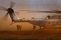 U.S. Marines with Alpha Company, 1st Battalion, 3rd Marine Regiment disembark from a CH-53E Super Stallion helicopter with Marine Heavy Helicopter Squadron (HMH) 463 at the Kahuku Training Area on Oahu, Hawaii, July 31, 2012, to conduct a training mission with New Zealand soldiers and South Korean troops for Rim of the Pacific (RIMPAC) 2012.