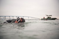 A U.S. Navy Basic Underwater Demolition/SEAL (BUD/S) student participates in interval swim training in San Diego Bay Aug. 2, 2012.