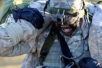 U.S. Army Sgt. Dante Hawthorne, with Alpha Company, 407th Brigade Support Battalion, carries a simulated wounded Soldier during a field exercise at the Joint Readiness Training Center (JRTC), Fort Polk, La., Oct. 18, 2012.