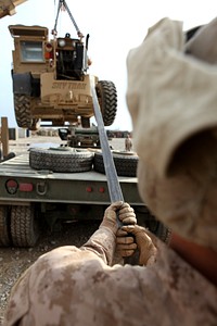 A U.S. Marine with Transportation Support Company, Combat Logistics Regiment 2 loads a forklift after conducting a combat logistics patrol (CLP) to Forward Operating Base Sabit Qadam in Helmand province, Afghanistan, Feb. 25, 2013.