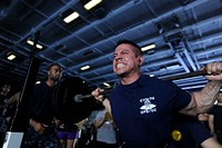 U.S. Navy Air Traffic Controller 1st Class Javier Lopez lifts weights during a squat competition in the hangar bay aboard the aircraft carrier USS John C. Stennis (CVN 74) April 12, 2013, in the U.S. 7th Fleet area of responsibility.