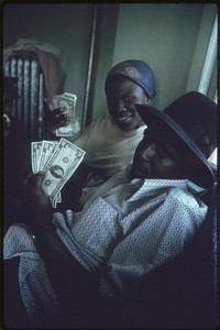 Black Family Count Their Cash In Their Apartment In South Side Chicago, 06/1973. Photographer: White, John H. Original public domain image from Flickr