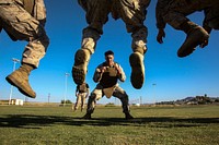 U.S. Marines with the 3rd Battalion, 7th Marine Regiment conduct a buddy warm up exercise and flexibility drill as part of a Martial Arts Instructor Trainer Course held aboard Marine Corps Air Ground Combat Center Twentynine Palms, Calif., June 5, 2013.