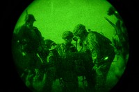 U.S. Army Paratroopers assigned to the 2nd Battalion, 505th Parachute Infantry Regiment, 3rd Brigade Combat Team, 82nd Airborne Division gather for instructions during a Joint Operational Access Exercise (JOAX) at Fort Bragg, N.C., June 26, 2013.