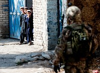 Children watch as a U.S. Soldier with 2nd Battalion, 506th Infantry Regiment, 4th Brigade Combat Team, 101st Airborne Division (Air Assault), conducts a patrol with Afghan Uniformed Police near Forward Operating Base Salerno in Khost province, Afghanistan, July 4, 2013.