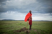 Josphat Mako, Maasai guide and companion to author and travel writer Stuart Butler stands in the Mara North Conservancy adjacent to Kenya's world famous Maasai Mara National Reserve.