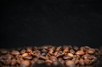 Roasted coffee beans, dark image with copy space