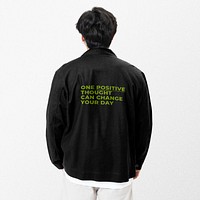 Black jacket mockup psd with inspirational quote street fashion photoshoot rear view