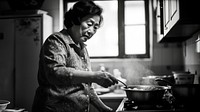 A photo of chinese aunt cooking.  