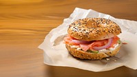 Close-up of Lox Bagel with onions on paper sheet. AI generated Image by rawpixel. 