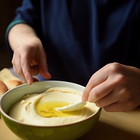 Freshly made hummus, ready to serve. AI generated image by rawpixel.