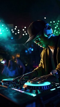 a photo of dj hand putting the music in a club.  