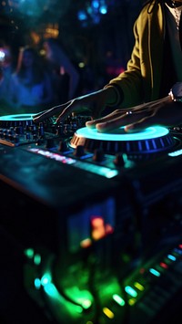 a photo of dj hand putting the music in a club.  