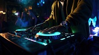 a photo of dj hand putting the music in a club.  