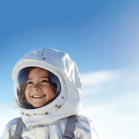 a photo of smiling girl child dressed as astronaut.  